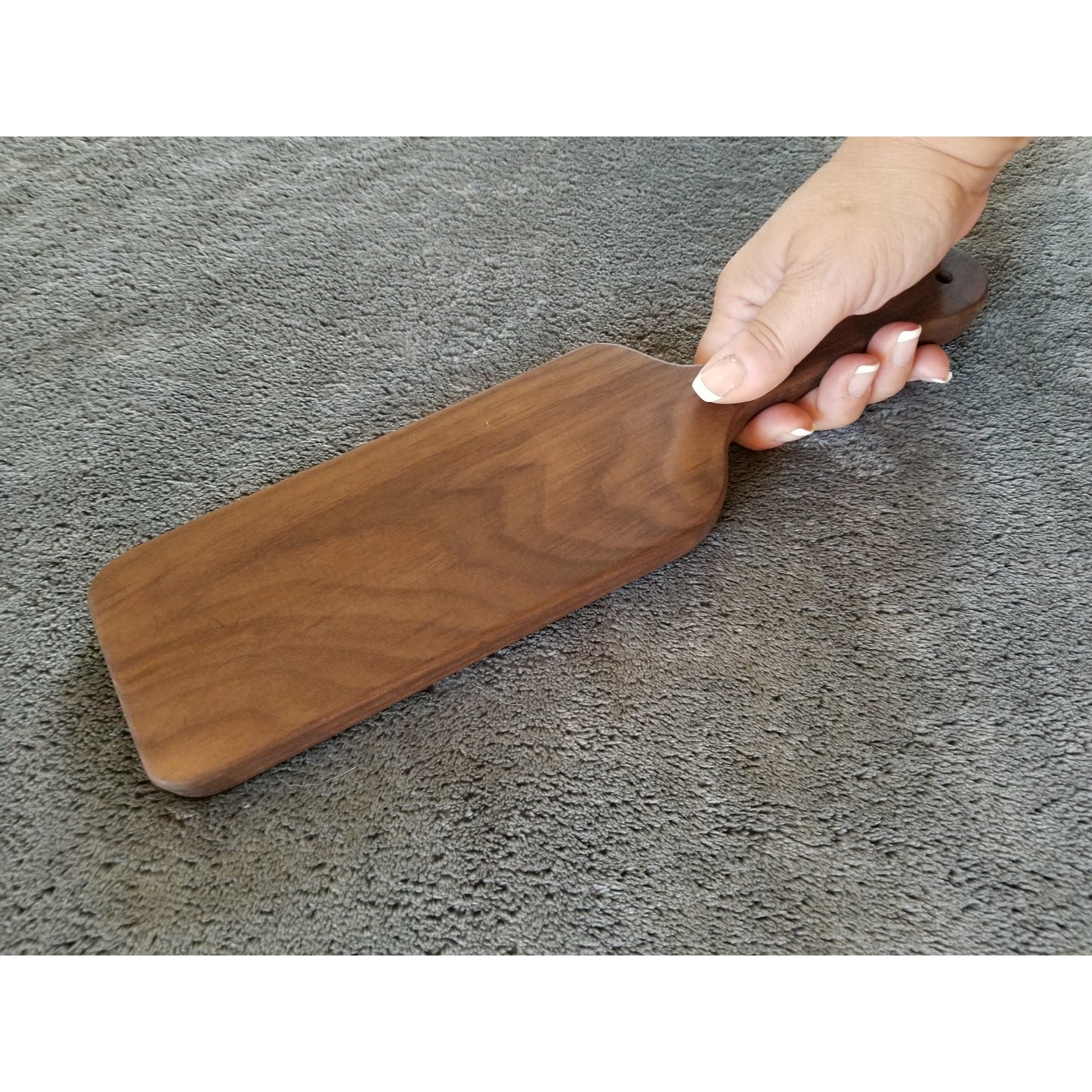 Unique wood spanking paddle with shark's tooth blade